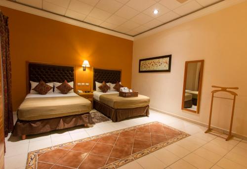 Hotel Rio Queretaro tesisinde bir odada yatak veya yataklar