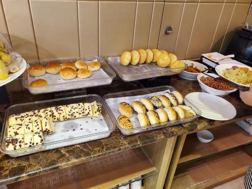 a buffet with trays of food on a table at Guangzhou Boyi Hotel in Guangzhou