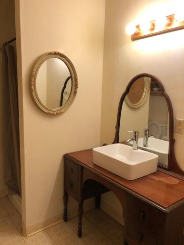 a bathroom with a sink and a mirror at Near the pier in Astoria, Oregon
