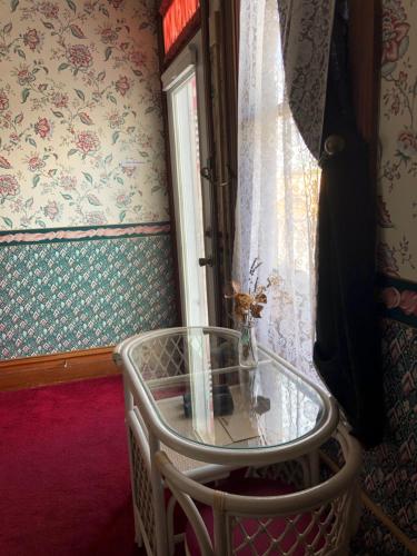 a glass table in a room with a window at Near the pier in Astoria, Oregon