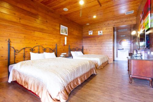 Postel nebo postele na pokoji v ubytování Liching Garden Villa