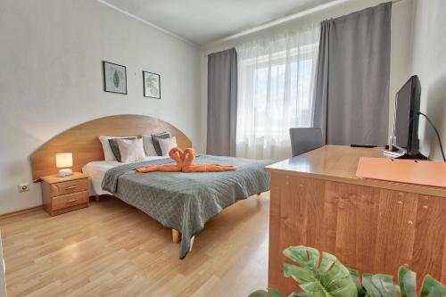 Кровать или кровати в номере Daily Apartments - Tatari street