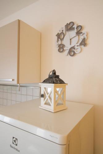 a kitchen counter with a light on top of a dishwasher at Casa Gardan in Levanto