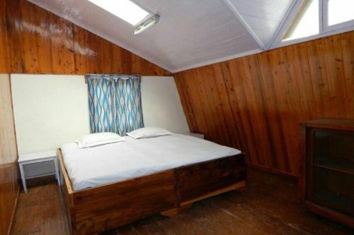 Postel nebo postele na pokoji v ubytování Pradhan's Cottages