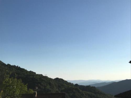 a view of a hill with mountains in the background at Agriturismo La Rosa Spina in Fivizzano
