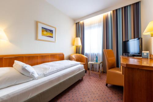 Postel nebo postele na pokoji v ubytování Trip Inn Hotel Esplanade