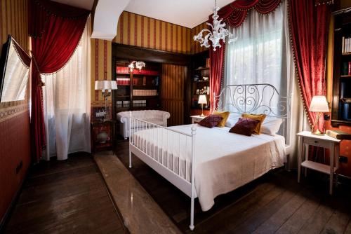 Postel nebo postele na pokoji v ubytování Palazzo Chiara