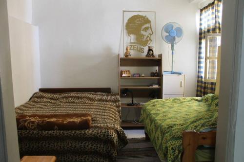 Кровать или кровати в номере Acropolis Crib Spot