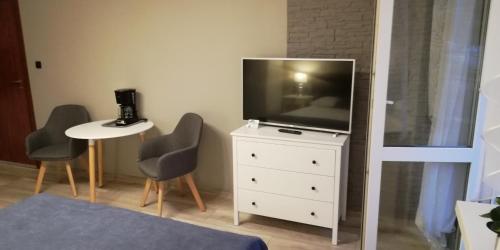 A television and/or entertainment center at Willa Donna
