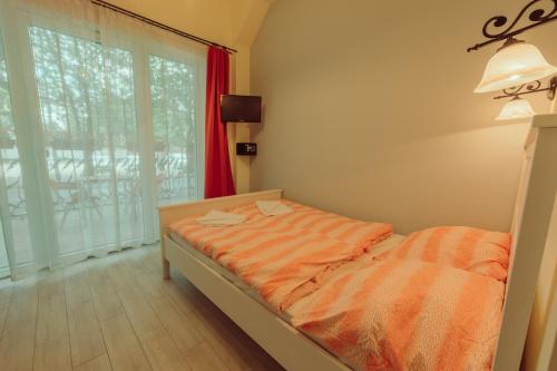 Llit o llits en una habitació de Pater Apartments and Rooms