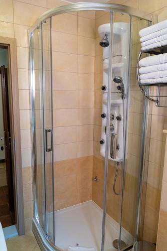 a shower with a glass enclosure in a bathroom at Apartments Linda in Makarska
