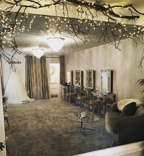 a dressing room with a table and a mirror at Slaters Country Inn in Whitmore