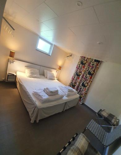 a bedroom with a bed in a small room at Byxelkrok, Solis in Byxelkrok