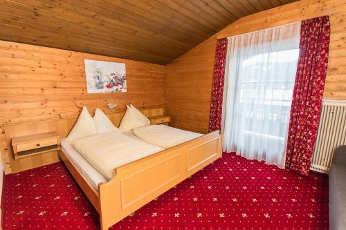 En eller flere senge i et værelse på Appartements Grabenbauer