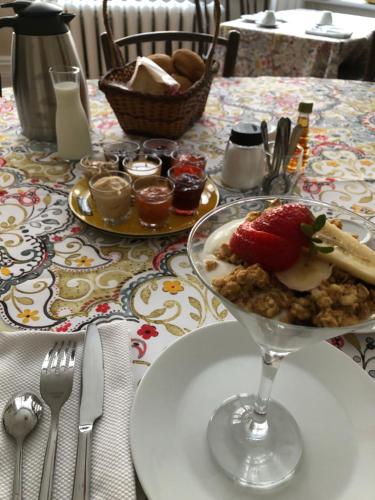a table with a plate of food on a table at B&B Chez Hubert in Quebec City
