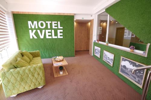 a living room with a couch and a table at Motel KVELE in Novi Pazar