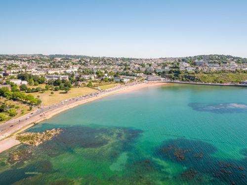 an aerial view of a beach and the ocean at Buckingham Lodge Guest House in Torquay