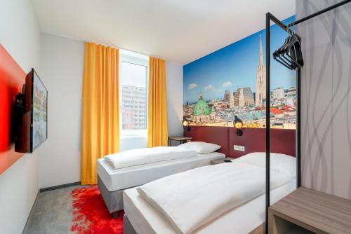 Postel nebo postele na pokoji v ubytování Campanile Vienna South