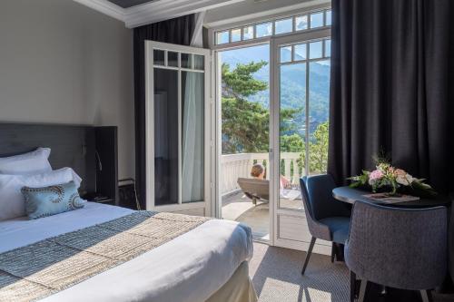 Postel nebo postele na pokoji v ubytování Golf Hôtel
