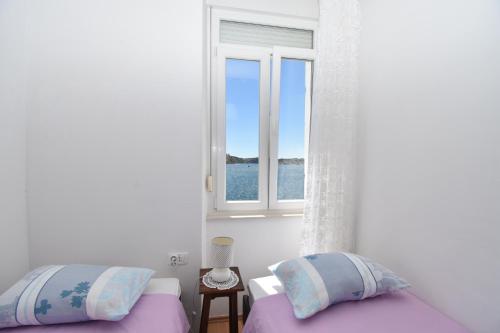Katil atau katil-katil dalam bilik di Apartmani Rina