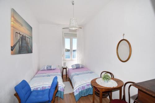 Katil atau katil-katil dalam bilik di Apartmani Rina