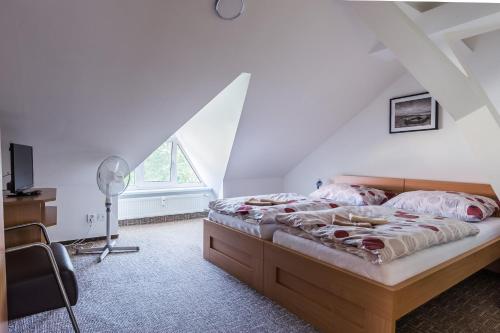 Кровать или кровати в номере Apartmány Humenné