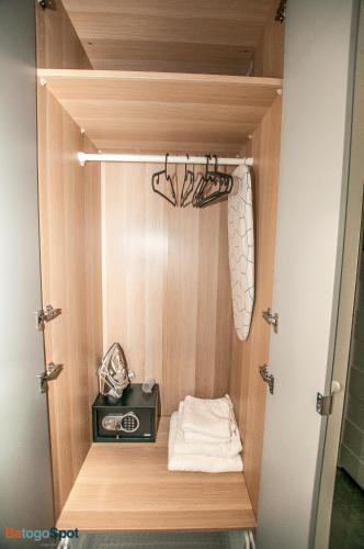 a small cabinet with a stove in a closet at BatogoSpot Tumski 2 in Wrocław