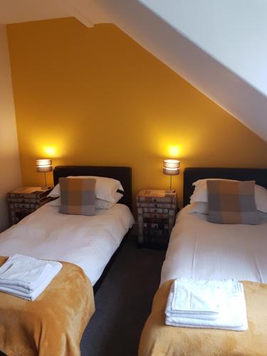 Un ou plusieurs lits dans un hébergement de l'établissement Wanslea Guest House
