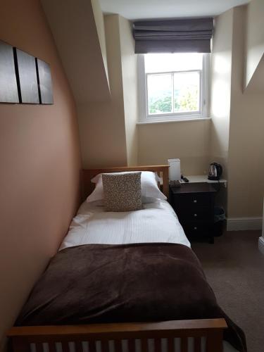 Un ou plusieurs lits dans un hébergement de l'établissement Wanslea Guest House