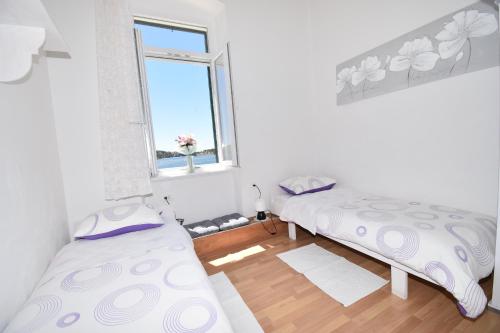 Katil atau katil-katil dalam bilik di Apartmani Rina