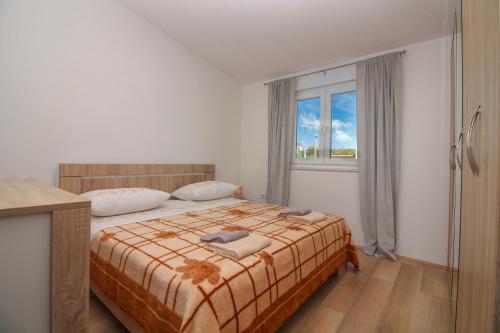 Postel nebo postele na pokoji v ubytování Conte Čikara Apartment