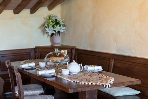 a wooden table with food on top of it at Monastero San Silvestro in Cortona