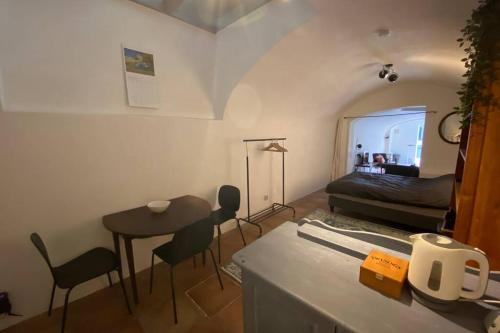 a small room with a table and a bed at Werfkelder aan de Oudegracht in Utrecht