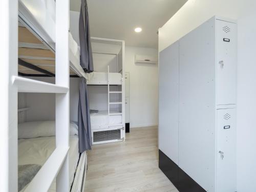 Двухъярусная кровать или двухъярусные кровати в номере El Hostel & CO