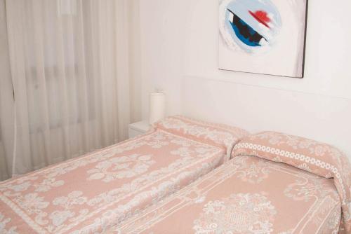 Postel nebo postele na pokoji v ubytování Torre d Oboe Alquilevante LVV077