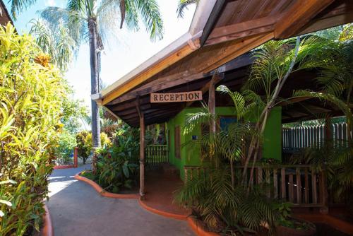 a building with a sign that reads reception at Sunrise Club Hotel in Negril
