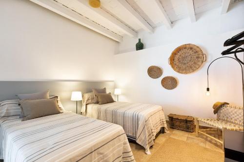 Säng eller sängar i ett rum på Sant Mori- La Escala Boutique apartment