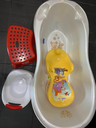 a childs bath tub with a toy in it at Pärnu Lubja Apartments in Pärnu