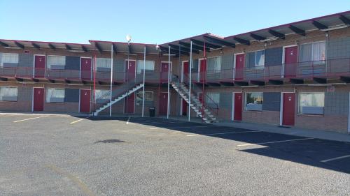 a building with a staircase on the side of it at Thunder Bird Motel in Mountain Home