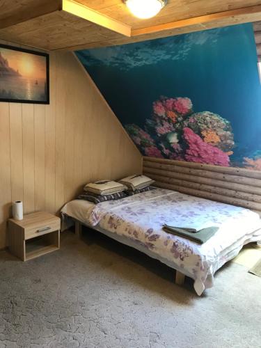 Postel nebo postele na pokoji v ubytování Viesu Nams Jūras sapņi