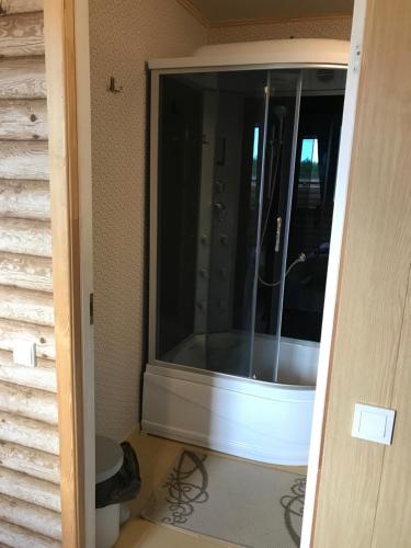 a bathroom with a window in a room at Viesu Nams Jūras sapņi in Dundaga