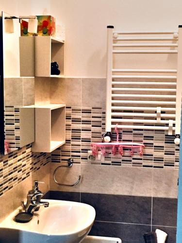 a bathroom with a sink and a toilet in it at B&B MaryGrace in Alghero