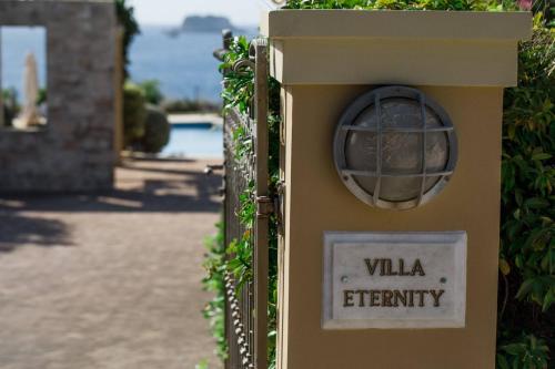 a sign that says villa eternity on a wall at Villa Eternity, Ai Helis Kefalonia in Kefallonia
