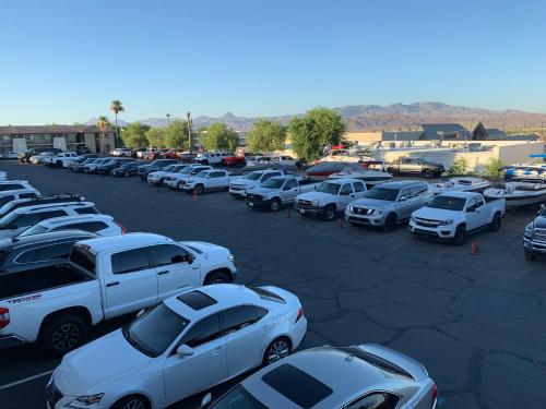a parking lot with a lot of cars parked at Days Inn by Wyndham Lake Havasu in Lake Havasu City