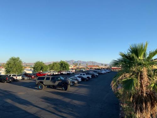 a row of cars parked in a parking lot at Days Inn by Wyndham Lake Havasu in Lake Havasu City