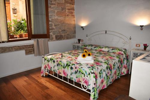 Posteľ alebo postele v izbe v ubytovaní Borgo San Sisto Apartment
