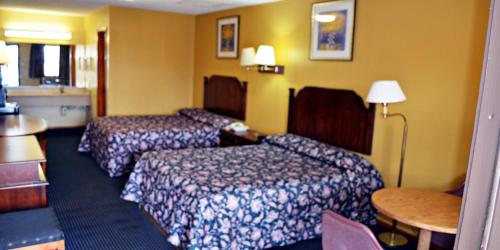 Cama o camas de una habitación en Aloha Inn