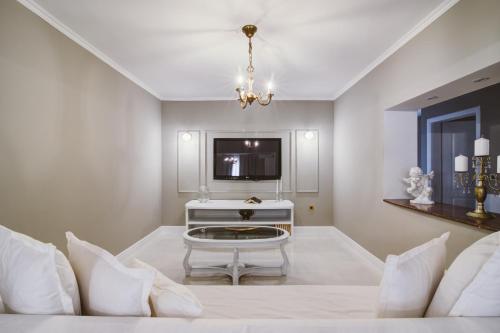 a living room with a white couch and a table at Apartment Lara in Senj