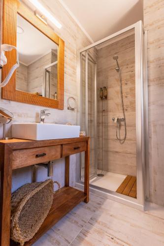 a bathroom with a sink and a shower at Casa da Mó - Douro in Armamar