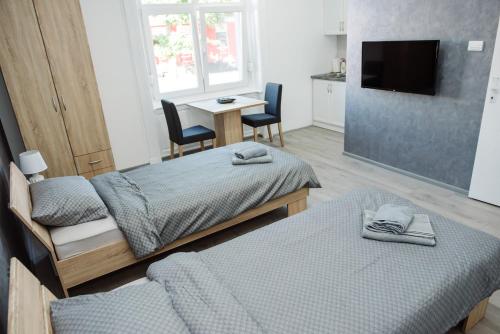 Postel nebo postele na pokoji v ubytování D&D apartments